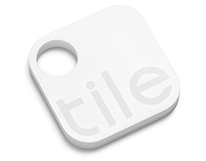 Picture of Tile device. Device is a white square with rounded corners with the word Tile in a light grey. It also has a round hole in a corner for a key ring.